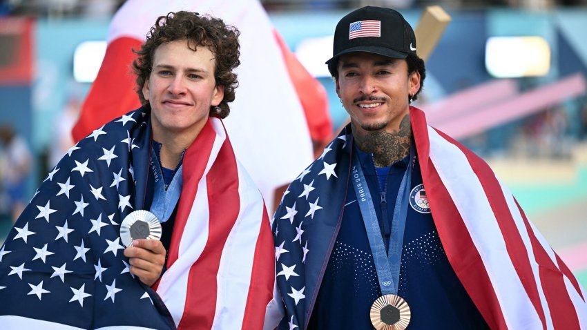 Jagger Eaton and Nyjah Huston pose with Olympic medals.