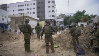 Israeli soldiers stand outside Shifa Hospital in Gaza City, Nov. 22, 2023. Israel released the director of Gaza's main hospital on Monday, seven months after the military raided the facility over allegations it was being used as a Hamas command center.