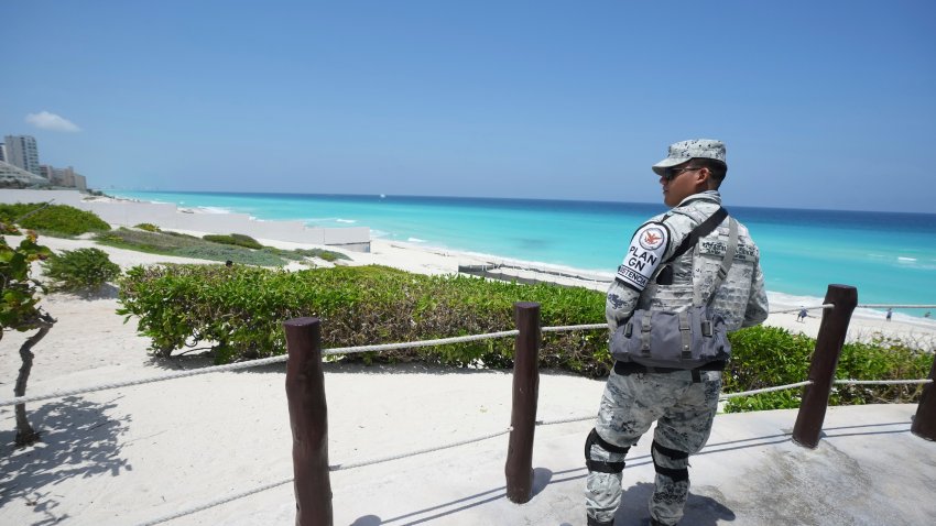 A Mexican soldier stands guard on a beach ahead of Hurricane Beryl’s expected arrival, in Cancun, Mexico, Wednesday, July 3, 2024.