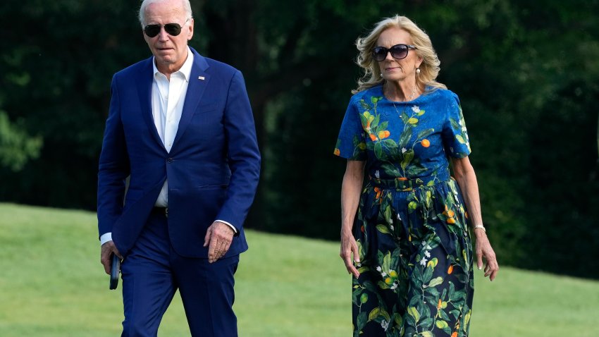 President Joe Biden, left, and first lady Jill Biden walk on the South Lawn of the White House in Washington, Sunday, July 7, 2024, after returning from events in Pennsylvania. (AP Photo/Susan Walsh)