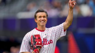 FILE – Actor Rob McElhenney acknowledges the crowd prior to a London Series baseball game between the New York Mets and the Philadelphia Phillies at The London Stadium in London, Sunday, June 9, 2024. McElhenney keeps an eye on the Phillies no matter how far away he is filming TV shows or leading his Wrexham soccer team. He even goofed around with the Phillies on their recent trip to London.