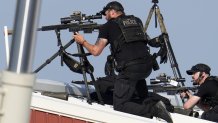 Police snipers return fire after shots were fired while Republican presidential candidate former President Donald Trump was speaking at a campaign event in Butler, Pa., on Saturday, July 13, 2024. (AP Photo/Gene J. Puskar)