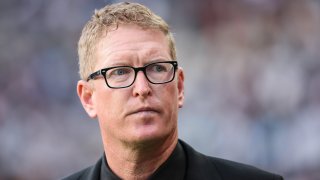 Philadelphia Union coach Jim Curtin looks down.