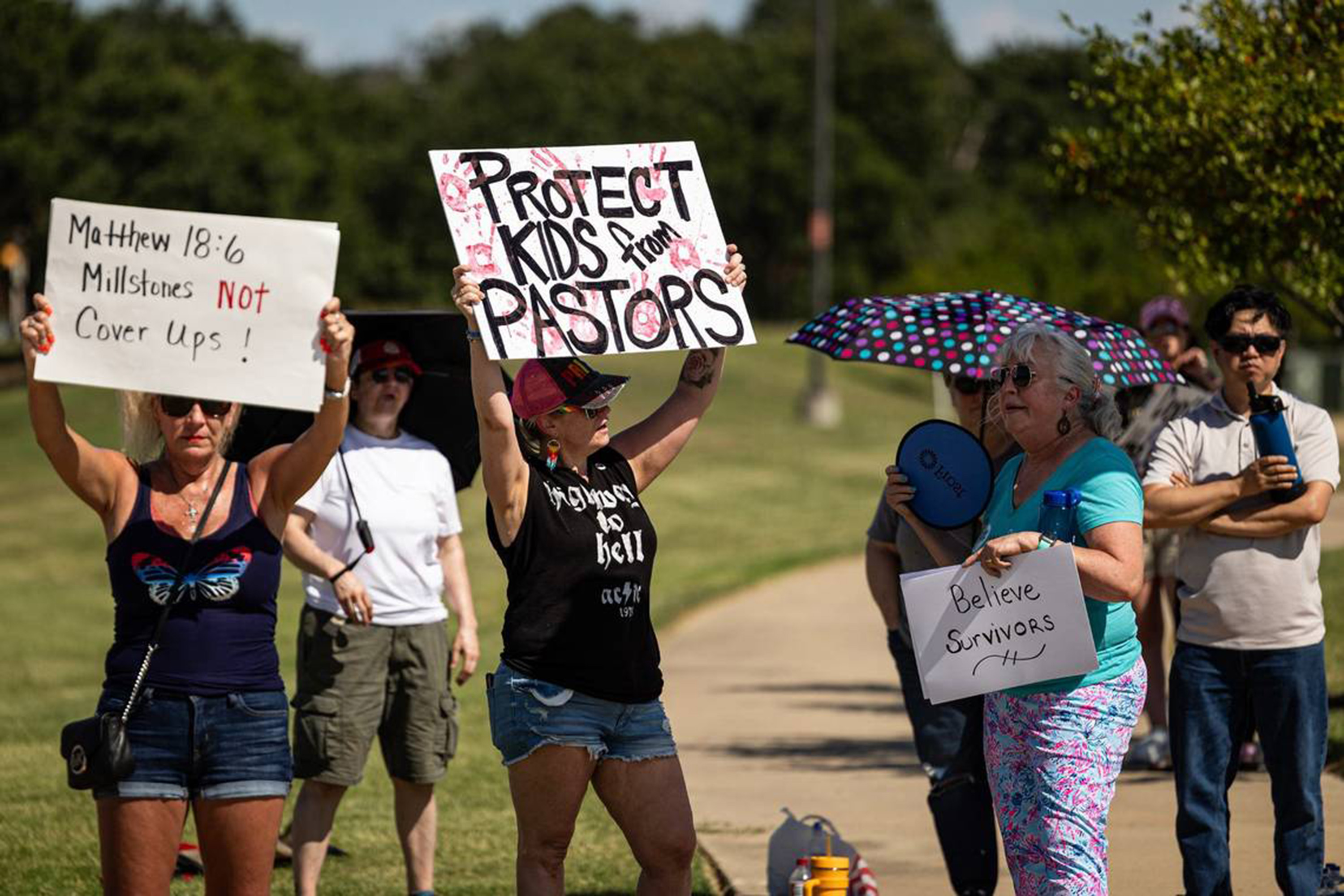 People gather outside Gateway Church in protest of child sexual abuse in the church following allegations against Robert Morris, on Saturday, June 22, 2024, in Southlake, Texas. (Chris Torres/Fort Worth Star-Telegram/Tribune News Service via Getty Images)