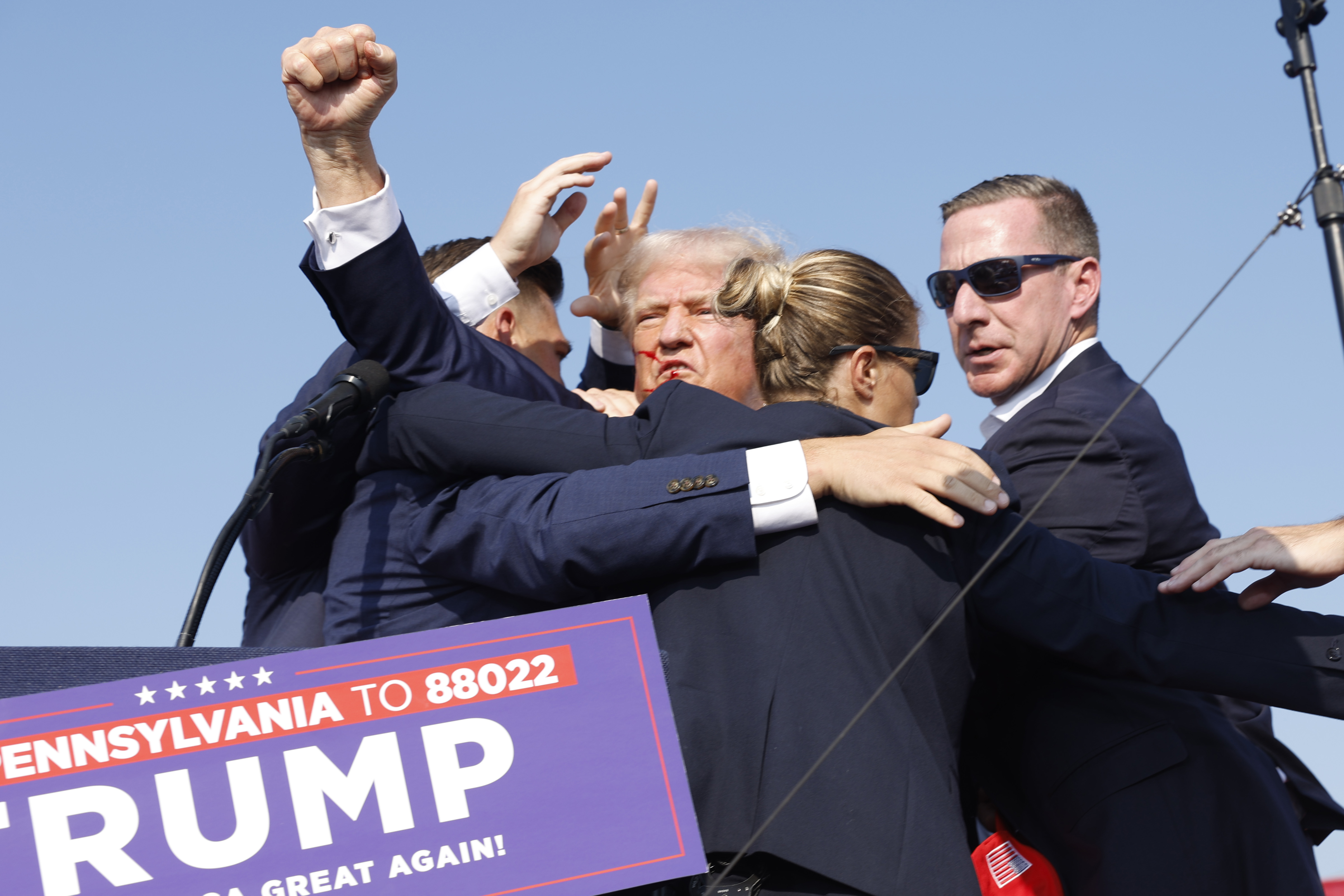 Republican presidential candidate former President Donald Trump is rushed offstage during a rally on July 13, 2024 in Butler, Pennsylvania.