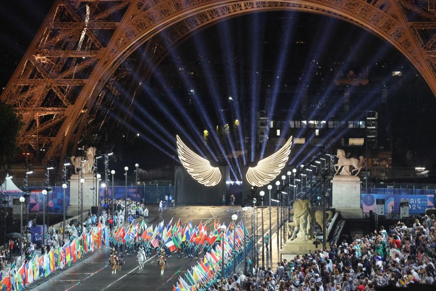 Floriane Issert, a Gendarmerie non-commissioned officer of the National Gendarmerie, carries the Olympic flag