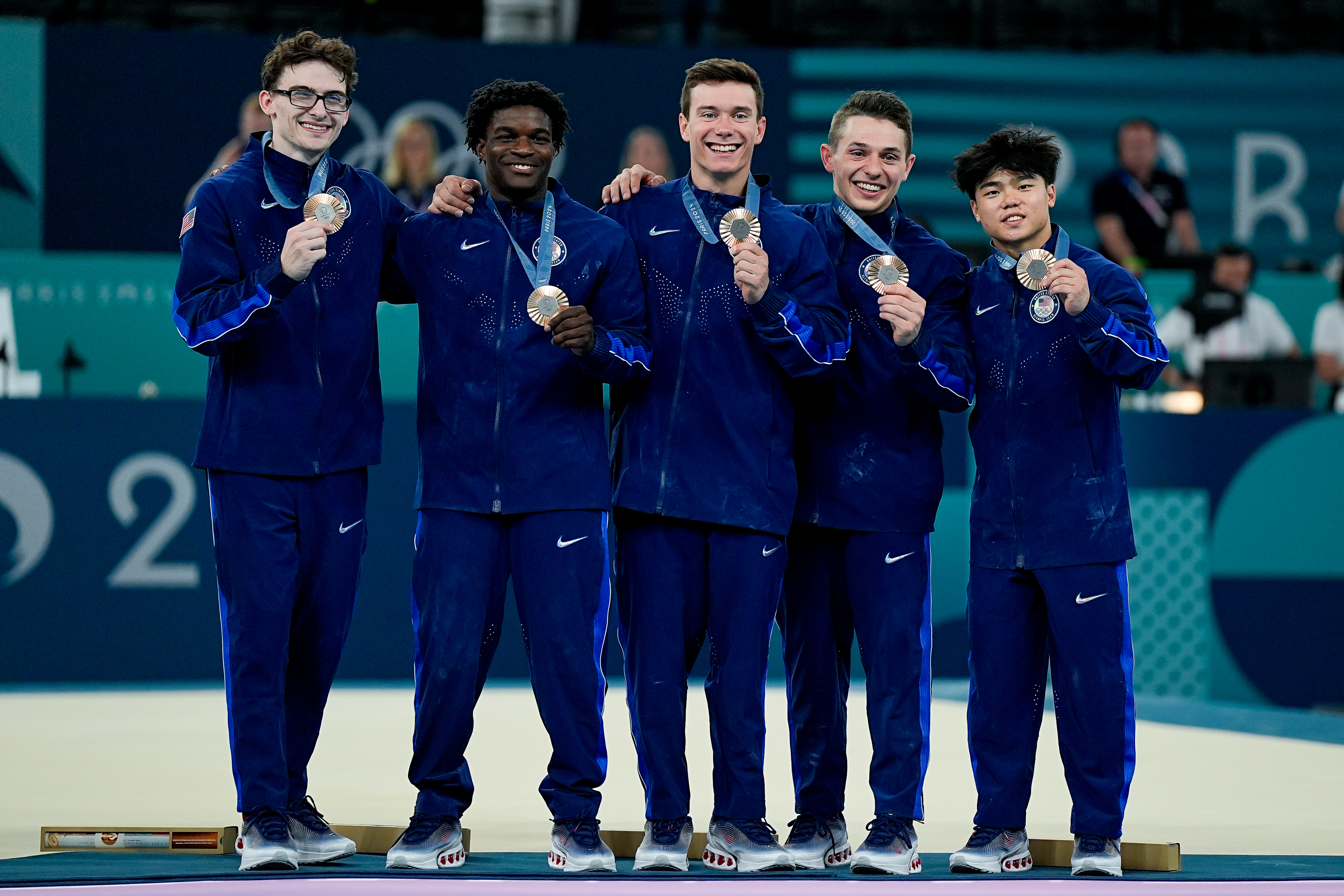 PARIS, FRANCE - JULY 29: (L-R) Stephen Nedoroscik of United States, Frederick Richard of United States, Brody Malone of United States, Paul Juda of United States, Asher Hong of United States pose for a photo with their bronze medals during the Men's Artistic Gymnastics Team Final on day three of the Olympic Games Paris 2024 at Bercy Arena on July 29, 2024 in Paris, France.