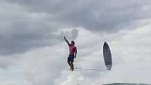 TOPSHOT - Brazil's Gabriel Medina reacts after getting a large wave in the 5th heat of the men's surfing round 3, during the Paris 2024 Olympic Games, in Teahupo'o, on the French Polynesian Island of Tahiti, on July 29, 2024. (Photo by Jerome BROUILLET / AFP) (Photo by JEROME BROUILLET/AFP via Getty Images)