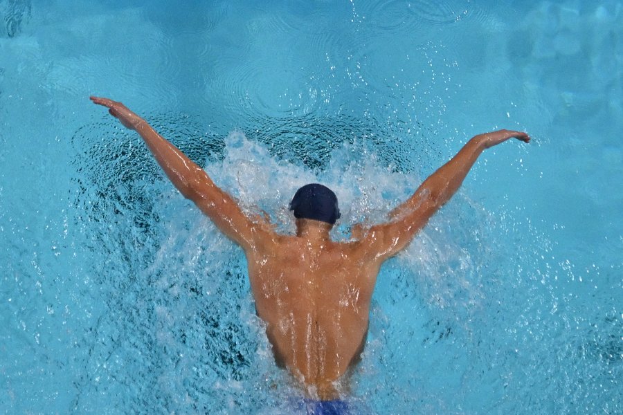 France's Leon Marchand competing in a heat of the men's 200m butterfly swimming event during the Paris 2024 Olympic Games at the Paris La Defense Arena in Nanterre, west of Paris, on July 30, 2024. 