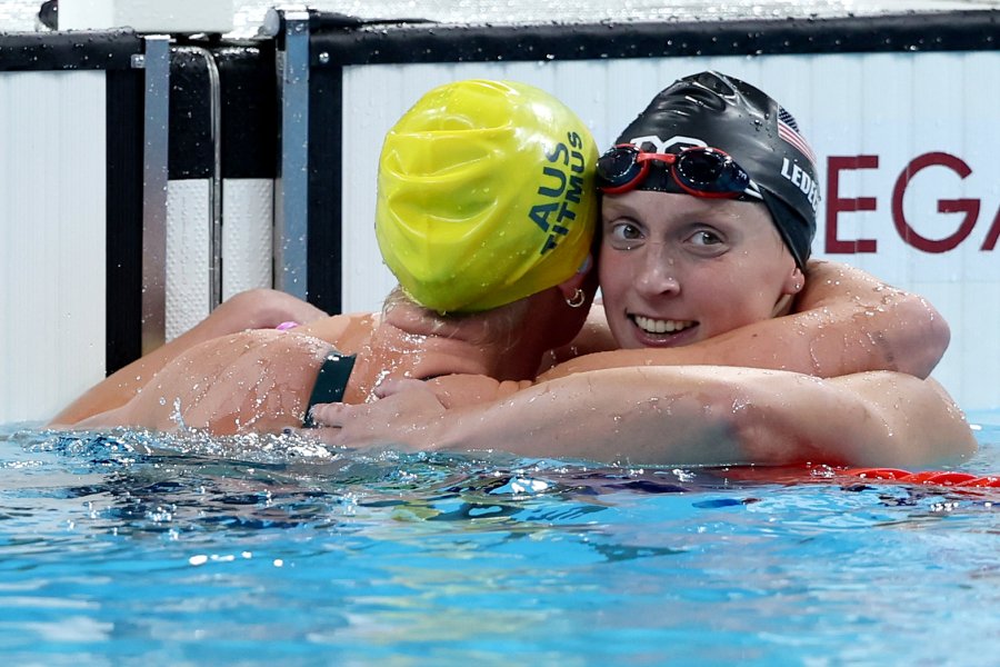 Katie Ledecky of Team United States and Ariarne Titmus of Team Australia celebrate after winning bronze and gold