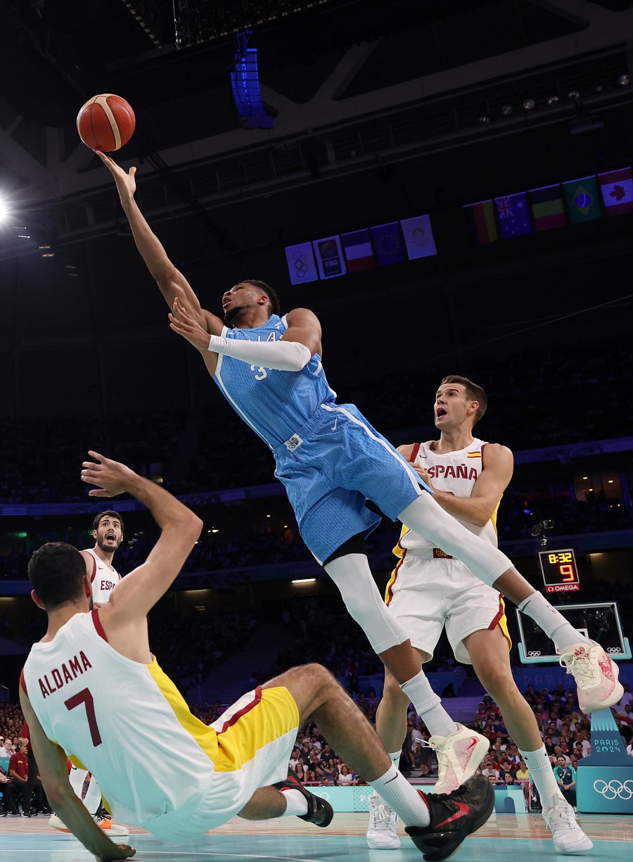 Giannis Antetokounmpo #34 of Team Greece shoots whilst under pressure from Xabi Lopez-Arostegui #6 and Santi Aldama #7 of Team Spain during the Men's Group Phase - Group A match between Team Spain and Team Greece on day four of the Olympic Games Paris 2024 at Stade Pierre Mauroy on July 30, 2024 in Lille, France.