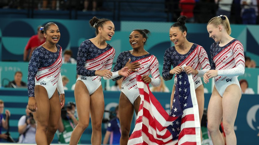 PARIS, FRANCE – JULY 30: Simone Biles , Hezly Rivera , Jade Carey , Jordan Chiles and Sunisa Lee of Team United States celebrate winning the gold medal after the Artistic Gymnastics Women’s Team Final on day four of the Olympic Games Paris 2024 at Bercy Arena on July 30, 2024 in Paris, France. (Photo by Christina Pahnke – sampics/Getty Images)