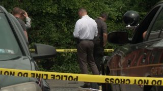 Law enforcement officials investigate after a corporal with the Pennsylvania State Police was shot in Lancaster on Wednesday, July 24, 2024.