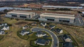 On what was recently farmland, Amazon data centers have been built as close as 50 feet from residential houses in the Loudoun Meadows neighborhood on January 20, 2023, in Aldie, VA.