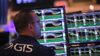 Traders work on the floor of the New York Stock Exchange on April 26, 2023 in New York City. 