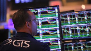 Traders work on the floor of the New York Stock Exchange on April 26, 2023 in New York City.
