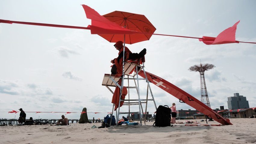 A lifeguard works at the beach at Coney Island on June 15, 2023 in the Brooklyn borough of New York City.