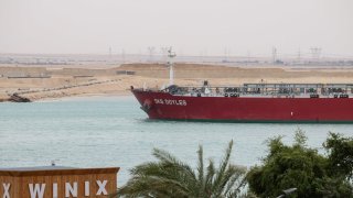 The SKS Doyles crude oil tanker moves along the Suez Canal towards Ismailia in Suez, Egypt, on Thursday, Dec. 21, 2023. A steep decline in the number of tankers entering a vital Red Sea conduit suggests that attacks on ships in the area are further disrupting a key artery of global trade.