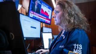 A trader works on the floor of the New York Stock Exchange.