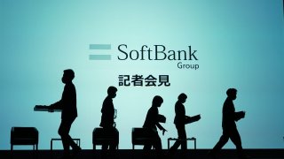 Workers on the stage as they prepare for a SoftBank Group Corp. news conference in Tokyo, Japan, on Thursday, June 27, 2024. 