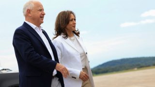 U.S. Vice President and Democratic presidential candidate Kamala Harris and her running mate Minnesota Governor Tim Walz walk as they prepare to depart at Chippewa Airport in Eau Claire, Wisconsin, U.S., August 7, 2024.