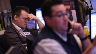 Traders work on the floor of the New York Stock Exchange during morning trading on August 12, 2024 in New York City. 