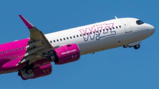 Wizz Air Malta Airbus A321 neo aircraft spotted at Eindhoven Airport during taxiing, taking off and flying phase in the blue sky. 