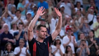 Andy Murray of Britain cries and waves to the spectators after he and his partner Daniel Evans defeated by Taylor Fritz and Tommy Paul of the United States in the men’s doubles quarterfinals tennis match, at the 2024 Summer Olympics, Thursday, Aug.1, 2024, at the Roland Garros stadium in Paris, France.