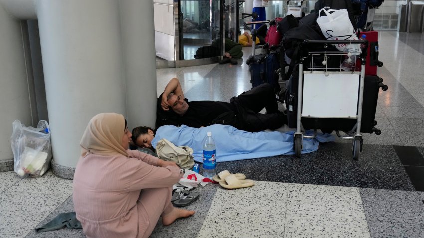 Passengers whose flights were cancelled, wait at the departure terminal ground of Rafik Hariri International Airport, in Beirut, Lebanon, Monday, Monday, Aug. 5, 2024. Turkey and Japan became the latest countries to urge their citizens to leave Lebanon amid rising tensions with Israel following last week's airstrike in Beirut that killed a top Hezbollah military commander. Fears of an escalation in the simmering conflict between Hezbollah and Israel have prompted some airlines to cancel flights to Lebanon.