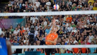 Spectators boo Netherland's Steven van de Velde as he serves to Brazil in a beach volleyball match at the 2024 Paris Olympics, Sunday, Aug. 4, 2024, in Paris.