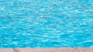 Bright Blue Pool water from perspective of the desk