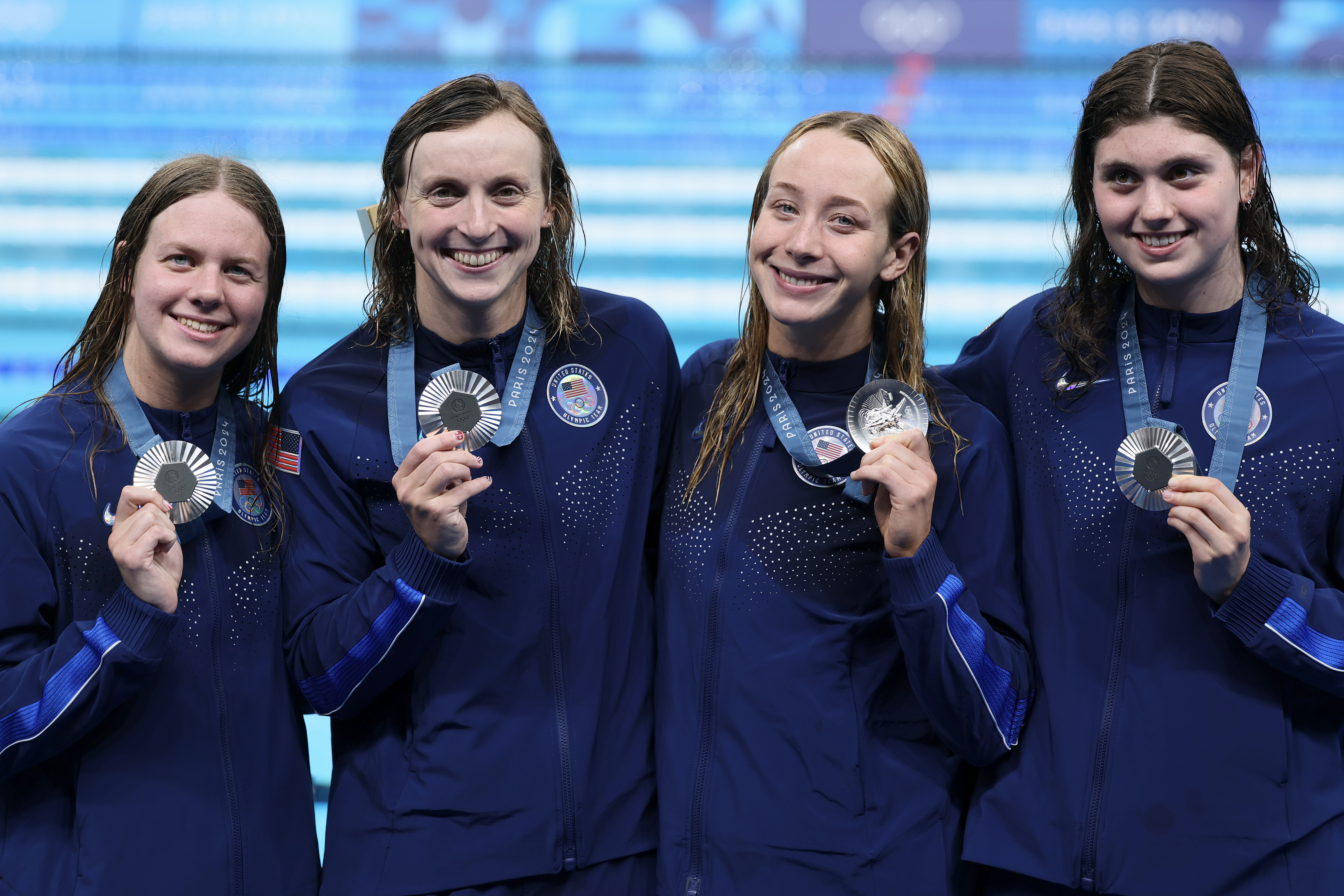 NANTERRE, FRANCE - AUGUST 01: Silver Medalists Claire Weinstein, Paige Madden, Katie Ledecky and Erin Gemmell of Team United States pose following the Swimming medal ceremony after the Women's 4x200m Freestyle Relay Final on day six of the Olympic Games Paris 2024 at Paris La Defense Arena on August 01, 2024 in Nanterre, France. (Photo by Clive Rose/Getty Images)