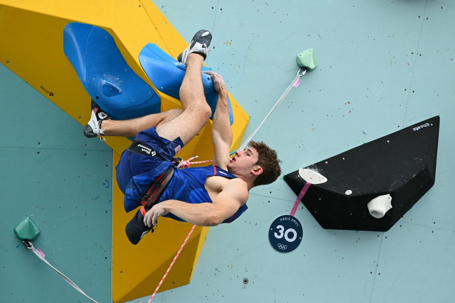 Colin Duffy competes in the men's sport climbing