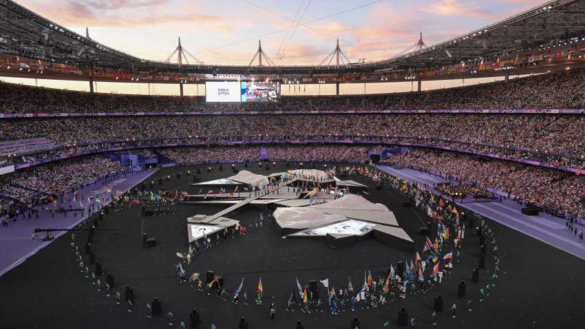 Delegations enter the stadium during the closing ceremony of the Paris 2024 Olympic Games at the Stade de France, in Saint-Denis, in the outskirts of Paris, on August 11, 2024. (Photo by Bertrand GUAY / AFP) (Photo by BERTRAND GUAY/AFP via Getty Images)