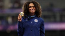 Gold medalist Sydney McLaughlin-Levrone of Team United States celebrates on the podium during the Women's 400m Hurdles medal ceremony on day fourteen of the Olympic Games Paris 2024 at Stade de France on August 09, 2024 in Paris, France. (Photo by Patrick Smith/Getty Images)