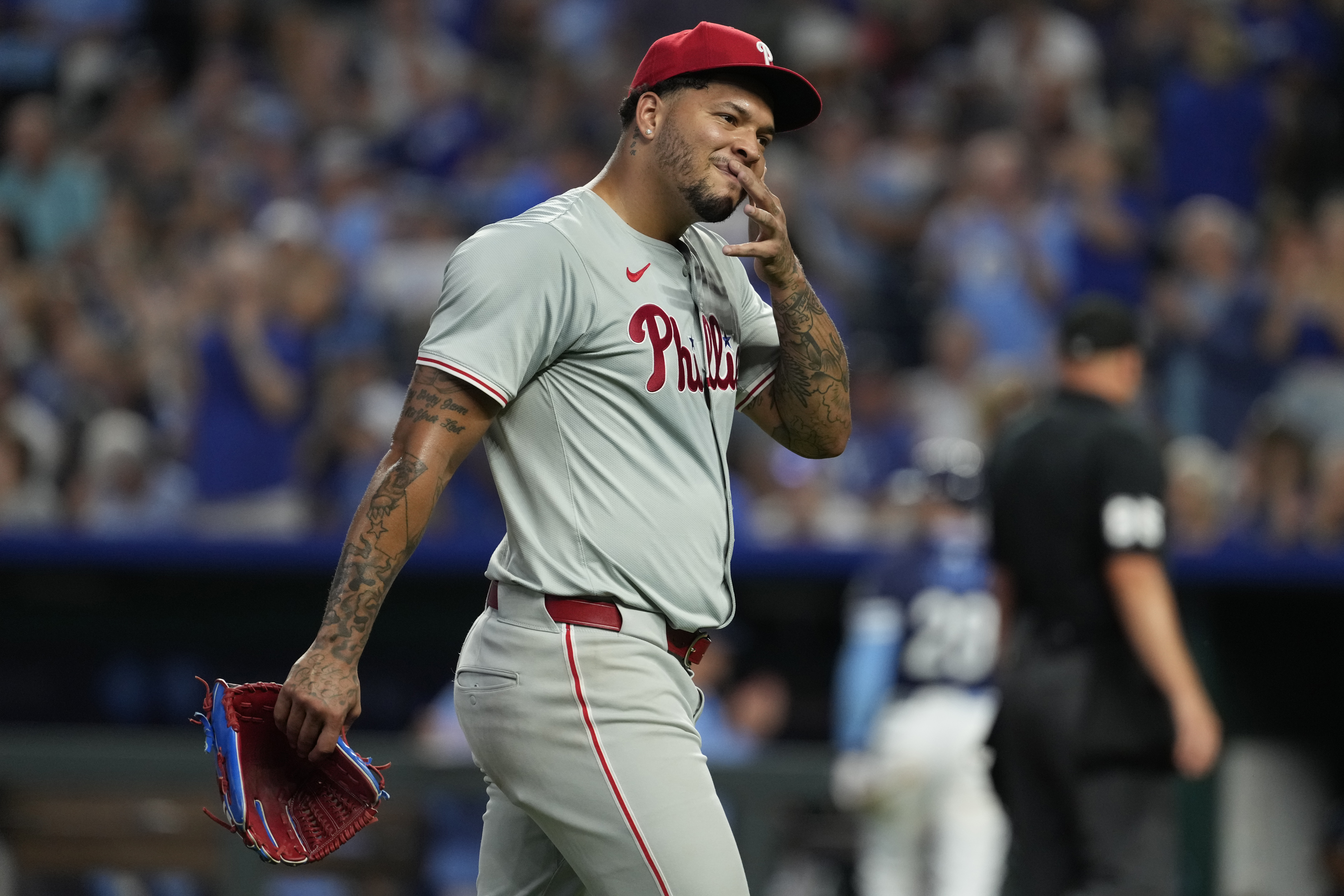 KANSAS CITY, MISSOURI – AUGUST 23: Taijuan Walker #99 of the Philadelphia Phillies walks off the field after throwing in the third inning at Kauffman Stadium on August 23, 2024 in Kansas City, Missouri. (Photo by Ed Zurga/Getty Images)