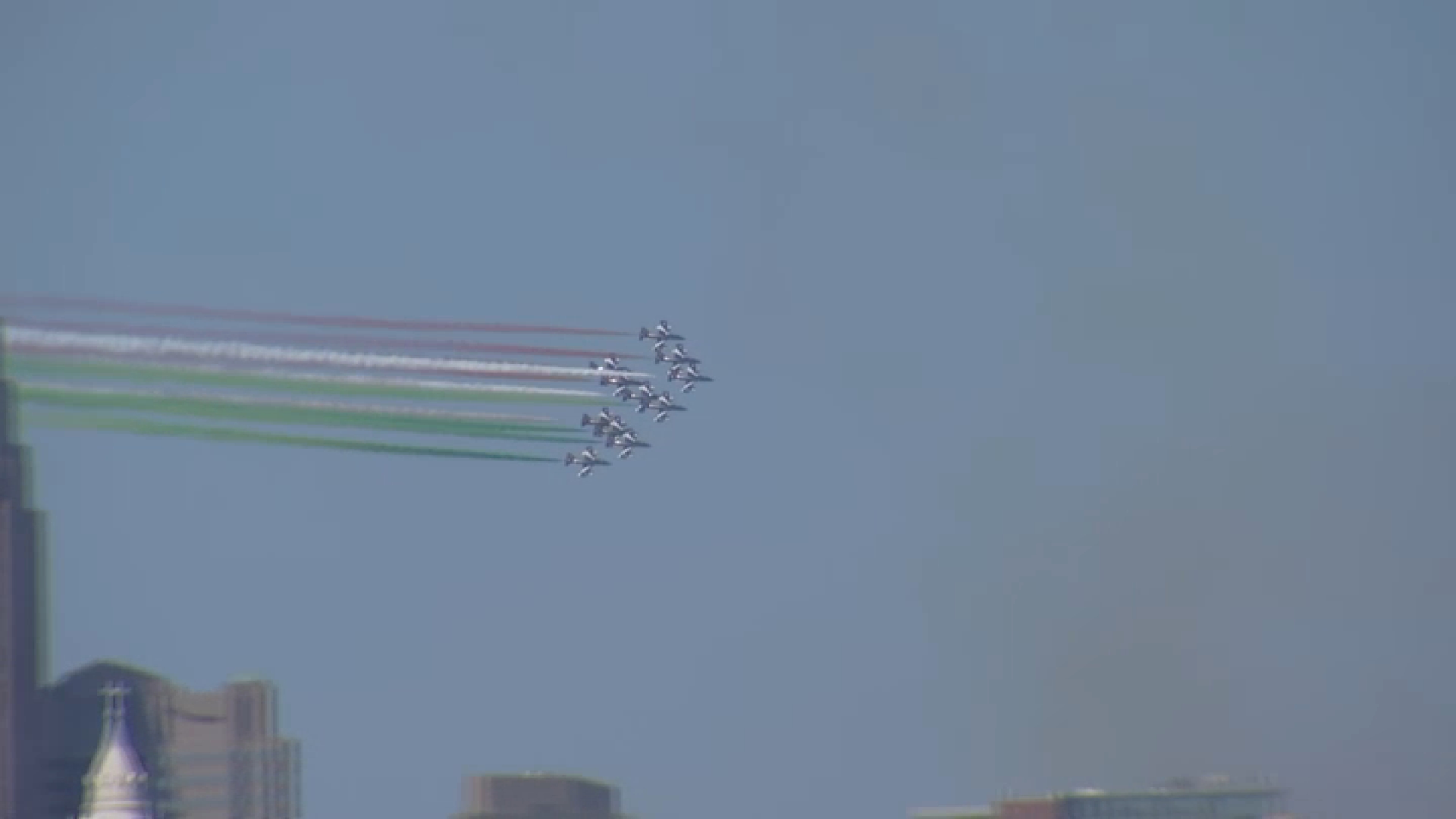 The Italian Air Force Frecce Tricolori deploy smoke in the colors of the Italian flag over Philadelphia on Monday morning.