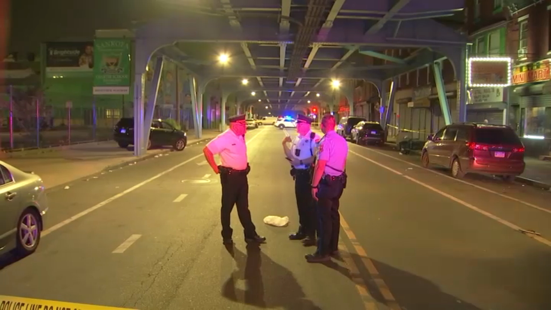 Police at the scene of a shooting that left a woman dead on Kensington Avenue, early Monday, Aug. 26, 2024.