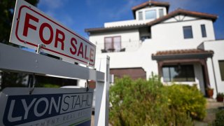 A for sale sign is displayed outside of a home for sale on August 16, 2024 in Los Angeles, California. United States real estate industry rules governing agent commissions will change on August 17 as part of a legal settlement between the National Association of Realtors and home sellers. (Photo by Patrick T. Fallon / AFP) (Photo by PATRICK T. FALLON/AFP via Getty Images)