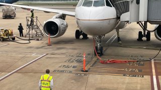 A pilot performs a walkaround before a United Airlines flight