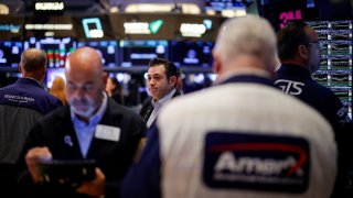 Traders work on the floor at the New York Stock Exchange (NYSE) in New York City, U.S., September 9, 2024. 