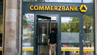 A customer enters a Commerzbank AG bank branch in Berlin, Germany, on Tuesday, Aug. 6, 2024.