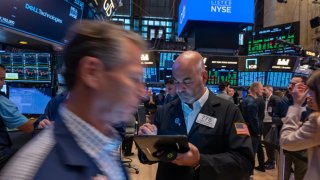 Traders work on the New York Stock Exchange floor on Sept. 13, 2024.