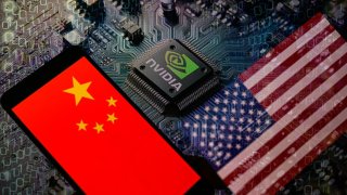 The flags of China and the USA are being displayed on a smartphone, with an NVIDIA chip visible in the background. 