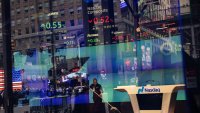 A worker sweeps the floor at the Nasdaq MarketSite in New York, US, on Monday, Sept. 16, 2024. 