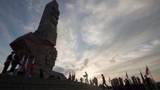 People lay a wreath at the monument to the 1939 heroic defense of the Westerplatte