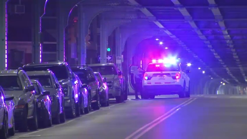 A police cruiser blocks the roadway after a teen would-be thief was shot in a robbery attempt in Kensington on Sunday night, police said.