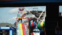 Fun slide and Ferris wheel seen at Gillian;'s Wonderland Pier in Ocean City, New Jersey, during summer of 2024.