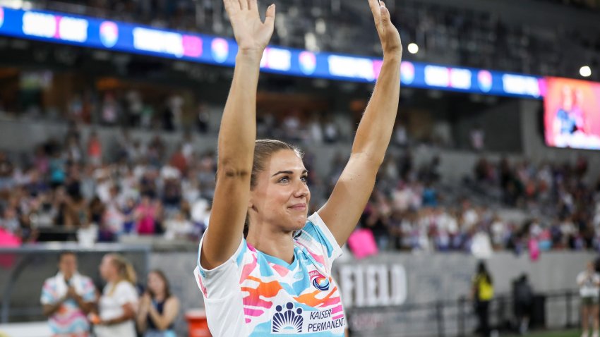 SAN DIEGO, CALIFORNIA – SEPTEMBER 08: Alex Morgan #13 of San Diego Wave FC waves to fans after the game against North Carolina Courage at Snapdragon Stadium on September 08, 2024 in San Diego, California. Morgan bid farewell to fans and fellow athletes after announcing her retirement from the game three days earlier, marking this game as her last. (Photo by Meg Oliphant/Getty Images)