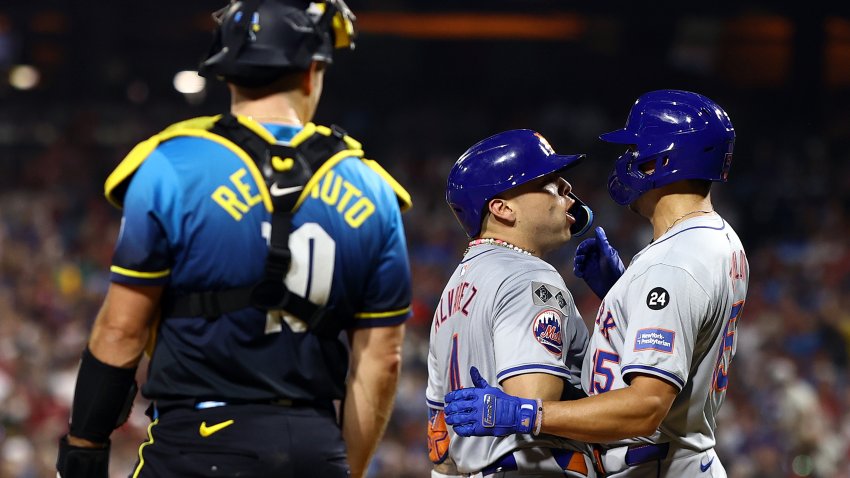 PHILADELPHIA, PENNSYLVANIA – SEPTEMBER 13: Francisco Alvarez #4 and Tyrone Taylor #15 of the New York Mets react following a three run home run hit by Alvarez during the fifth inning against the Philadelphia Phillies at Citizens Bank Park on September 13, 2024 in Philadelphia, Pennsylvania. (Photo by Tim Nwachukwu/Getty Images)